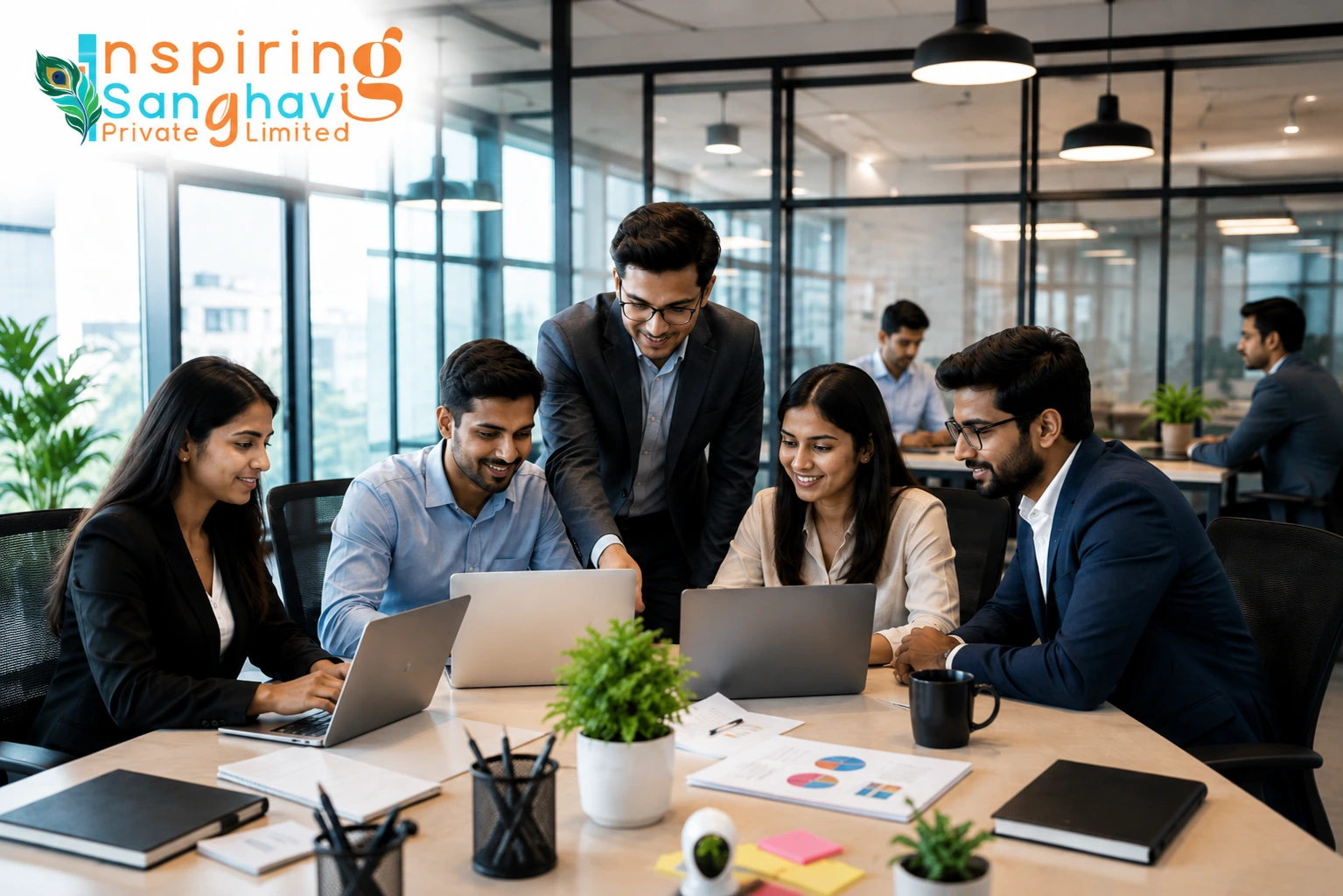 Professional team collaboration at Inspiring Sanghavi Private Limited in a modern corporate office workspace with employees working together on business and technology projects.