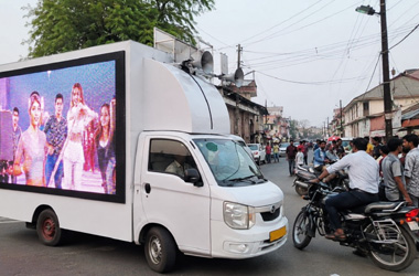Advertisement Services Professional LED advertising van promoting a marketing campaign on a busy city road for mobile brand promotion and business advertising in Lucknow.